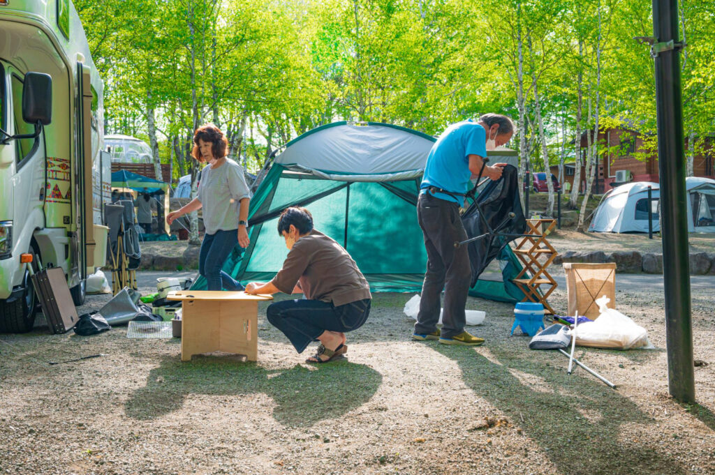 people in a campground keeping eachother safe