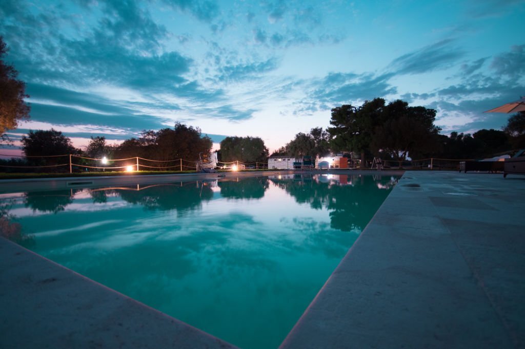 Sunset view of a pool in a campground