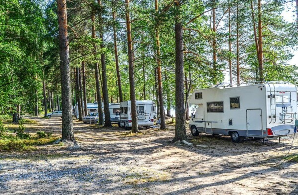 Motor homes in campground near lake summertime in Finland