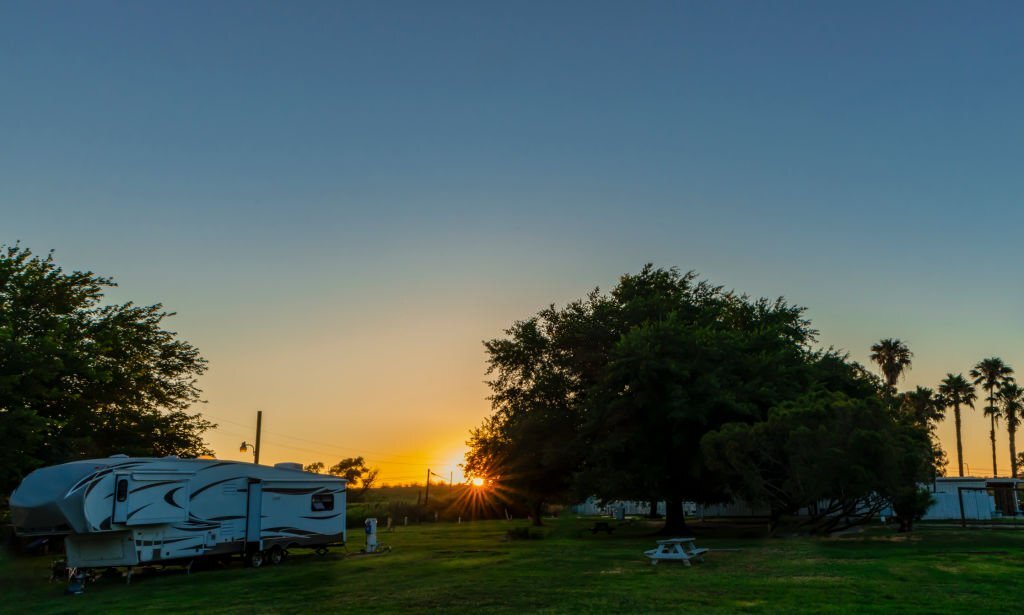 RVs at sunrise in an RV park or campground