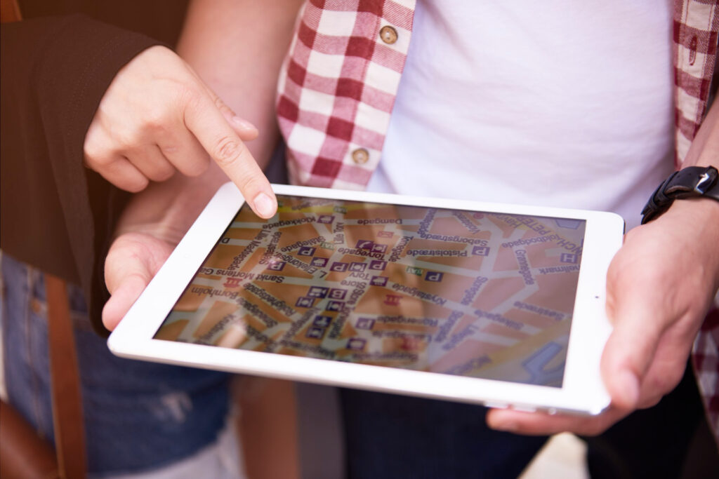 Two people checking the inventory system in their ipad