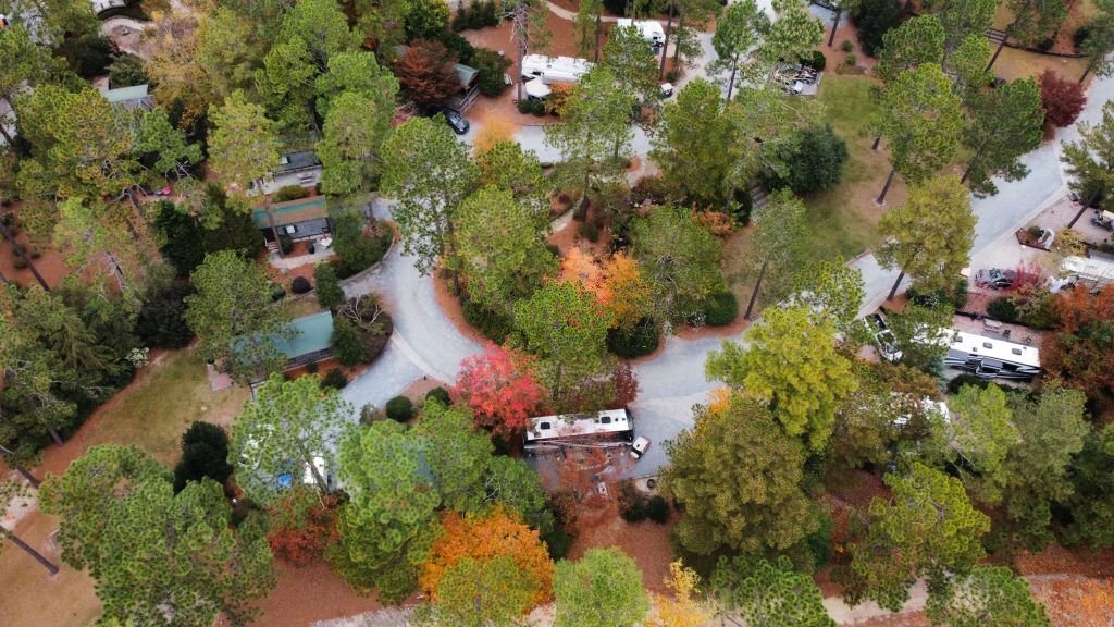 Aerial view of campground in a forest in autumn