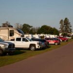 Cavendish, PEI- July 27, 2019: A line of trucks with RVs or winnebagos on a campground