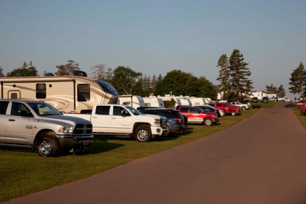 Cavendish, PEI- July 27, 2019: A line of trucks with RVs or winnebagos on a campground