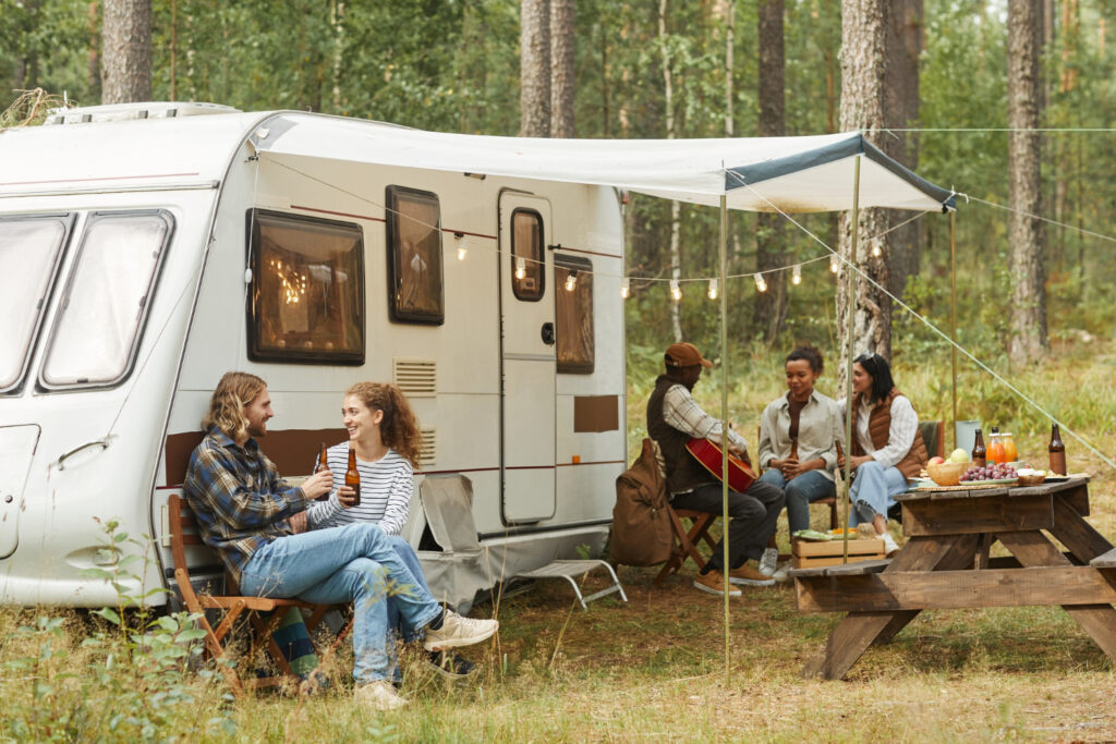 a group of people enjoying a stay in their campground using campground reservation software system