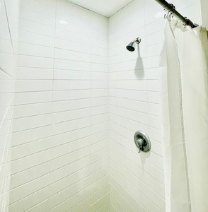 Private shower stalls offer plenty of space and hot water.