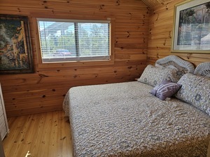 Cabin 3 is on the water front and has a king size bed, full kitchen, bunk beds, loft, living room and dining area. 
